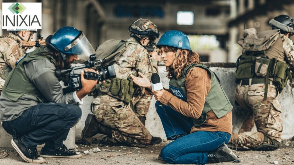 Image INIXIA - "Pendant une intervention militaire, deux journalistes font un reportage vidéo"